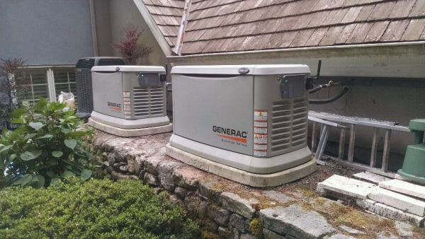 This customer in Redmond didn't have room for a larger single liquid coolded unit so our solution was to install two smaller 22kw generators on top of a retaining wall.